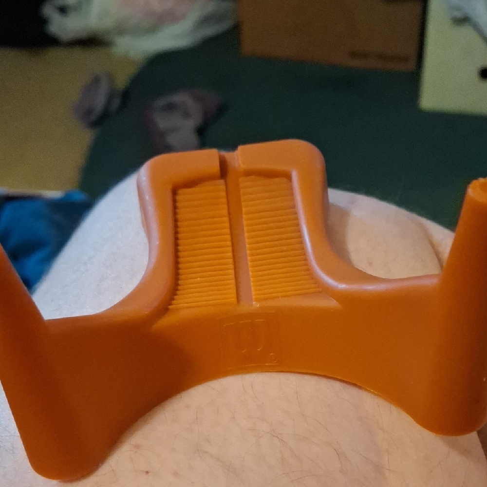 Orange Brown Plastic Football Holder with Embossed Wilson Logo Display